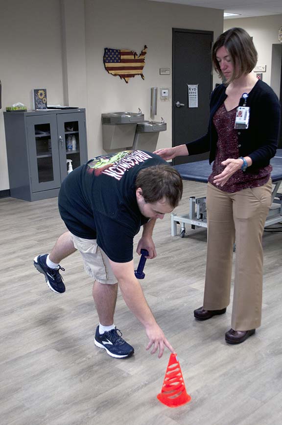 SHARE Military client works with therapist to perform rehabilitation exercise